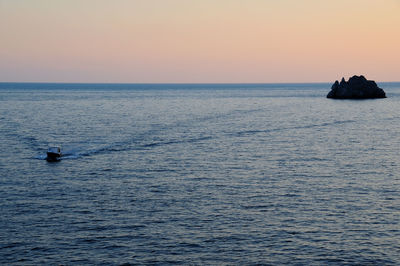 Silhouette of boat in sea