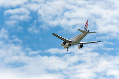 Commercial passenger jet airplane in mid flight, getting ready for landing