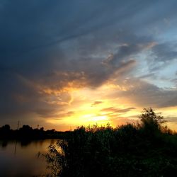 Scenic view of dramatic sky during sunset