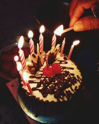 Close-up of hand holding cake