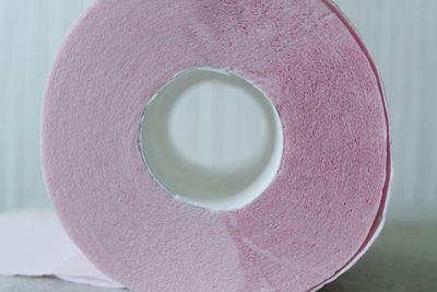 Close-up of pink cake against white background