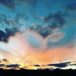 Low angle view of dramatic sky during sunset