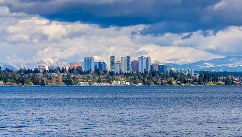 Modern buildings in bellevue, washington with the cascades range in the background.