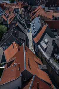 Rooftops and blue car in ancient town goslar, niedersachsen, germany