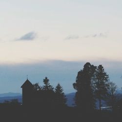 Scenic view of landscape against cloudy sky