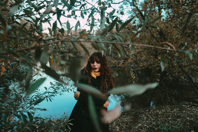 Portrait of young woman in forest