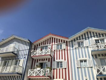 Low angle view of building against blue sky in costa nova, aveiro, portugal