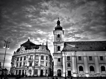 Low angle view of church against cloudy sky