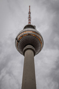 Low angle view of building against cloudy sky