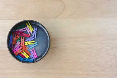 Directly above shot of colorful clothespins on table