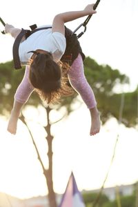 Full length of girl on bungee trampoline