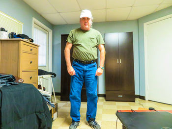 Portrait of man standing in corridor