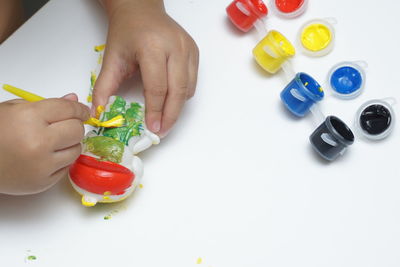 High angle view of hand holding multi colored candies