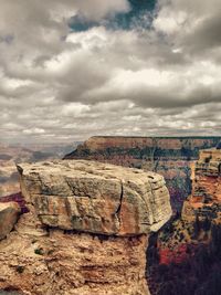 Scenic view of mountains against cloudy sky