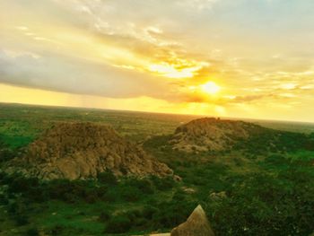 Scenic view of landscape against sky during sunset