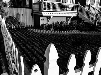 High angle view of fence at front yard against house