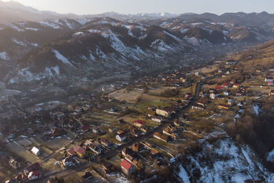 High angle view of townscape against mountains
