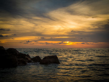 Scenic view of sea at sunset