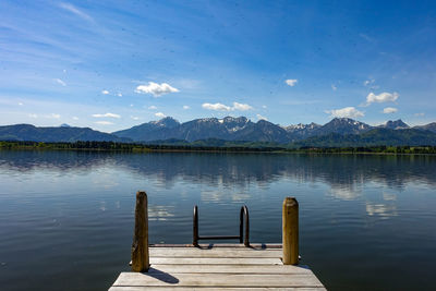 Pier over lake against sky