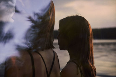 Portrait of woman with reflection in water