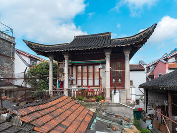 Exterior of houses against sky in city