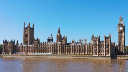 View of buildings in city against clear sky