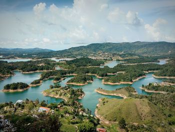 High angle view of islands in sea against cloudy sky