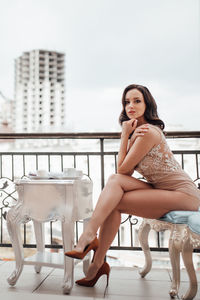 Portrait of woman sitting on chair