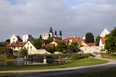 Buildings at almedalen park against cloudy sky