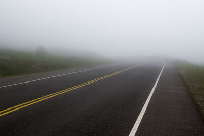 Road against sky during foggy weather