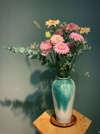 Close-up of pink flower vase on table