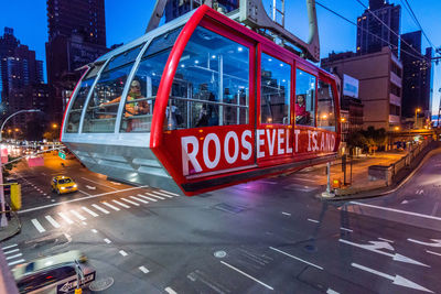 Overhead cable car over illuminated street at roosevelt island