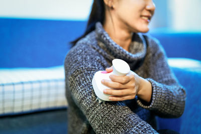 Woman holding coffee cup