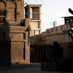 Exterior of old building in city against sky in dubai