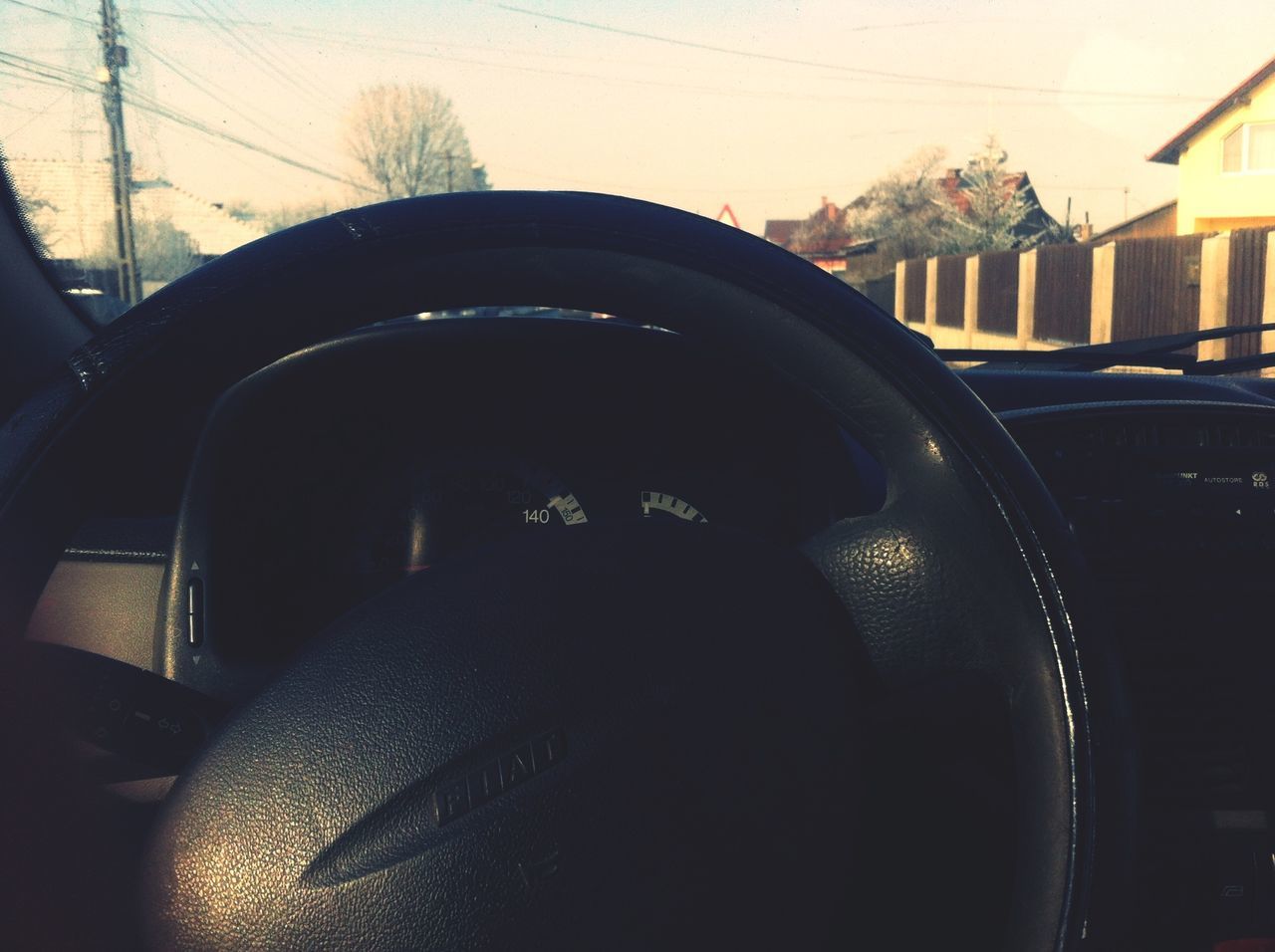 transportation, land vehicle, mode of transport, car, vehicle interior, travel, windshield, train - vehicle, window, reflection, indoors, public transportation, rail transportation, technology, car interior, sky, day, cable, street, railroad track