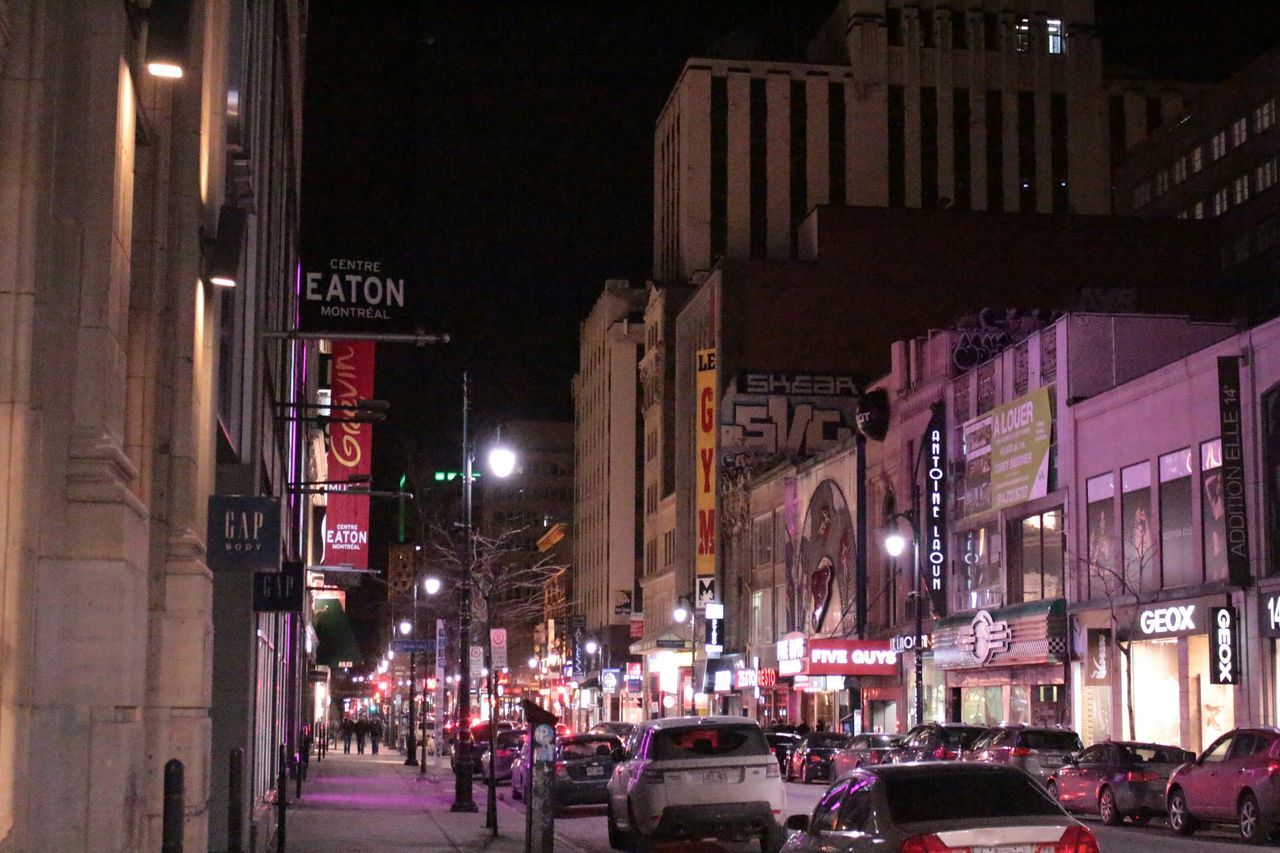 night, building exterior, illuminated, architecture, built structure, street, city, car, city life, transportation, street light, city street, land vehicle, road, building, lighting equipment, text, incidental people, outdoors