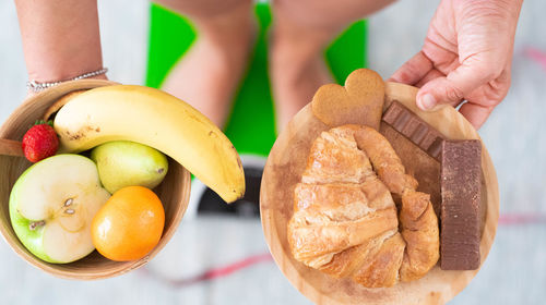 Close-up of woman holding fruits