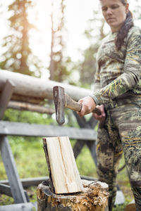 Woman chopping wood