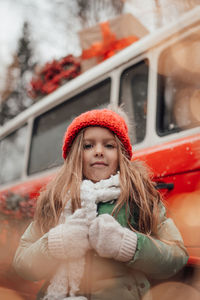 Portrait of young woman in car