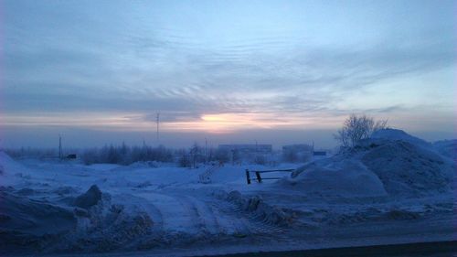 Scenic view of landscape against sky during winter