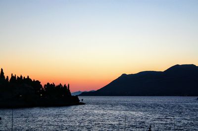 Scenic view of sea against clear sky during sunset