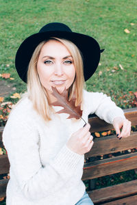 Portrait of smiling young woman in hat