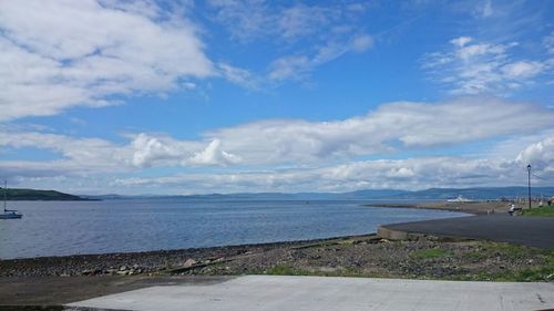 Scenic view of calm lake against blue sky