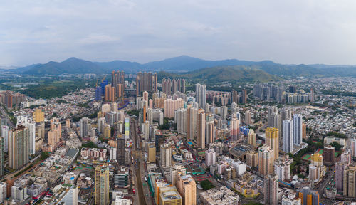 Aerial view of cityscape against sky