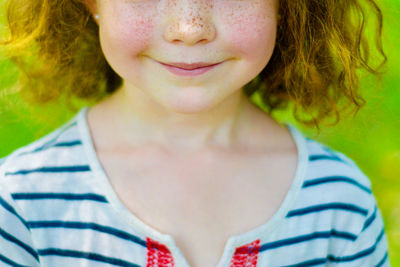 Close-up portrait of a smiling young woman