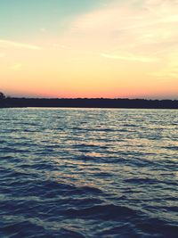 Scenic view of sea at sunset