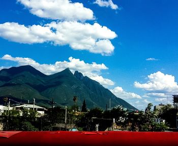 Scenic view of mountains against blue sky