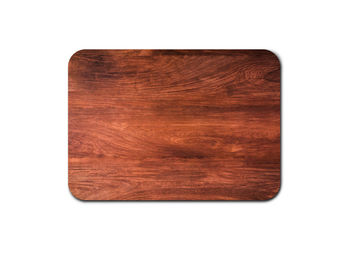 Directly above shot of bread on cutting board against white background