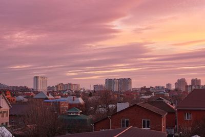 Cityscape against sky during sunset