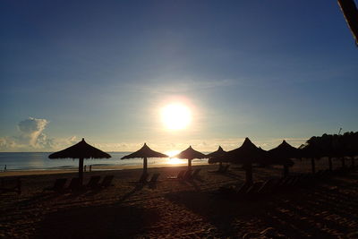 Scenic view of beach against sky during sunset